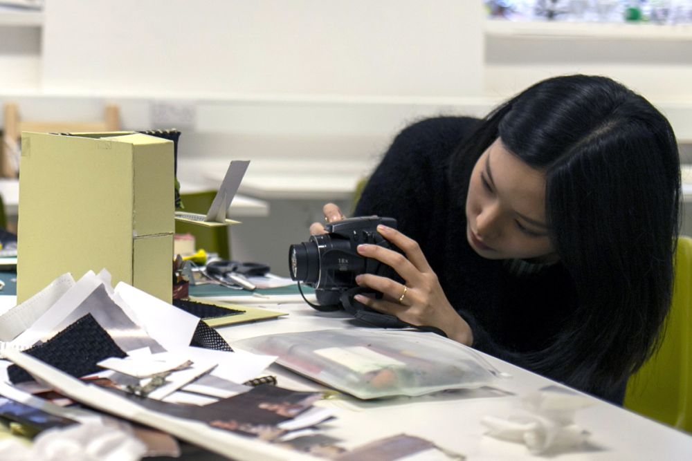 Student taking photo of 3D Model.