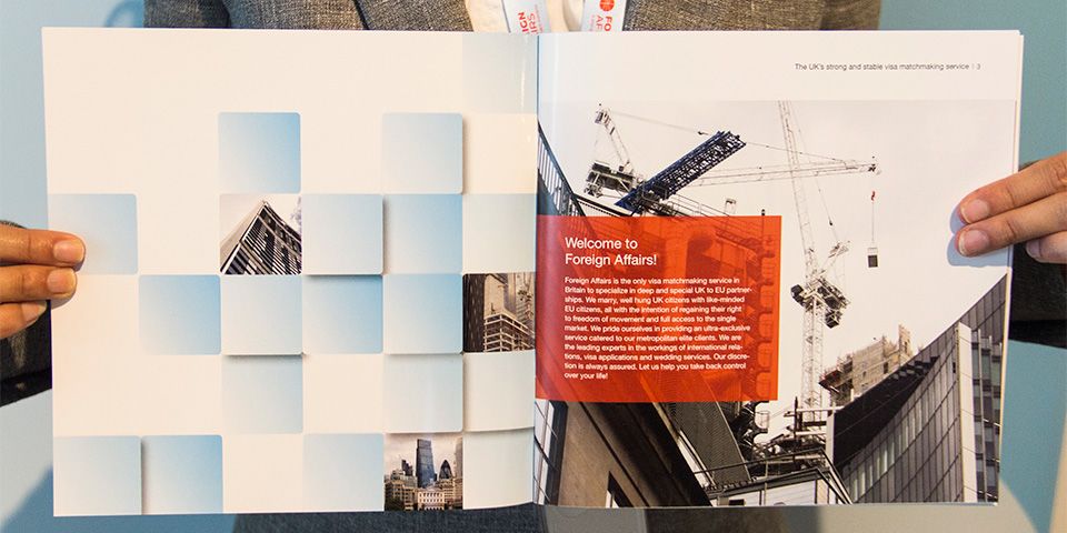 A person holding up an open magazine