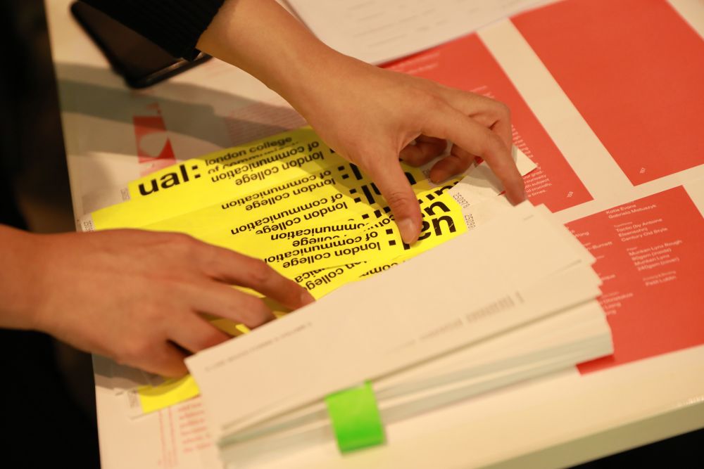 Colourful bookmarks and wristbands at reception desk.
