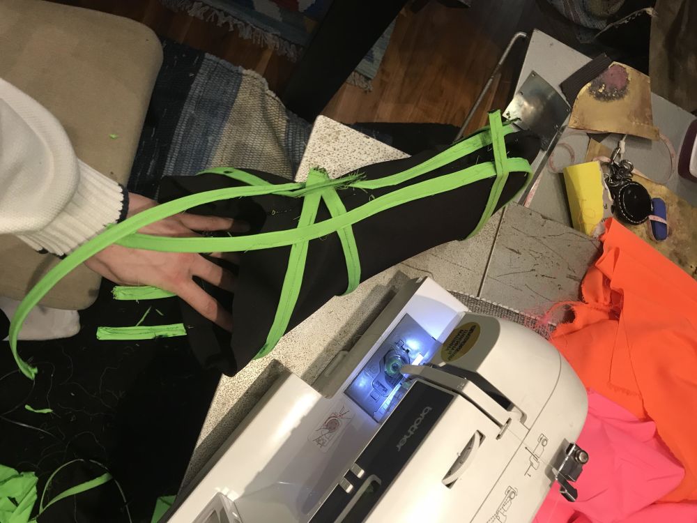 An enlarged thumb structure about to be sewn on a sewing machine 