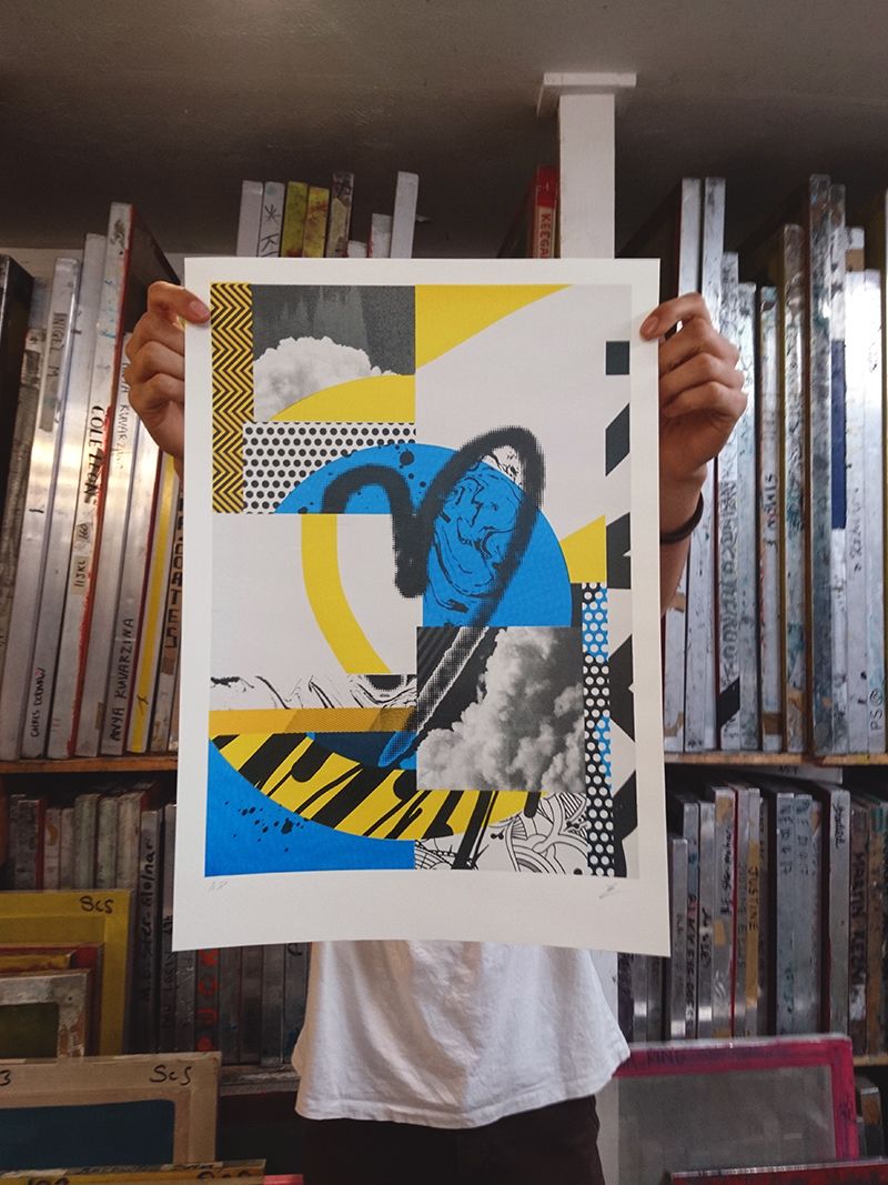 Screen print of heart being held up by a person with screens behind