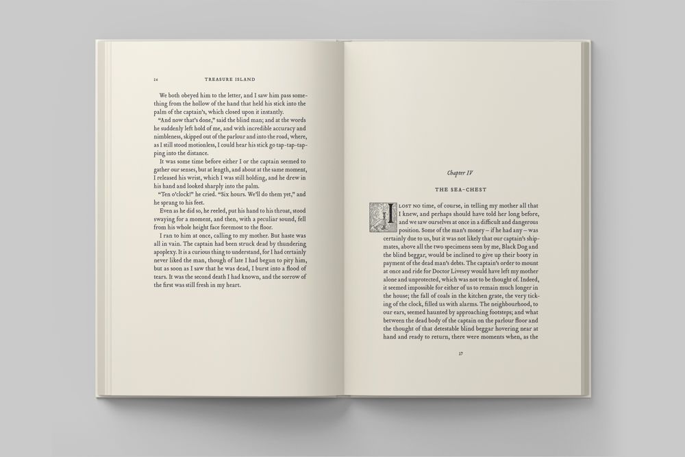 A book open on a table with text on the pages