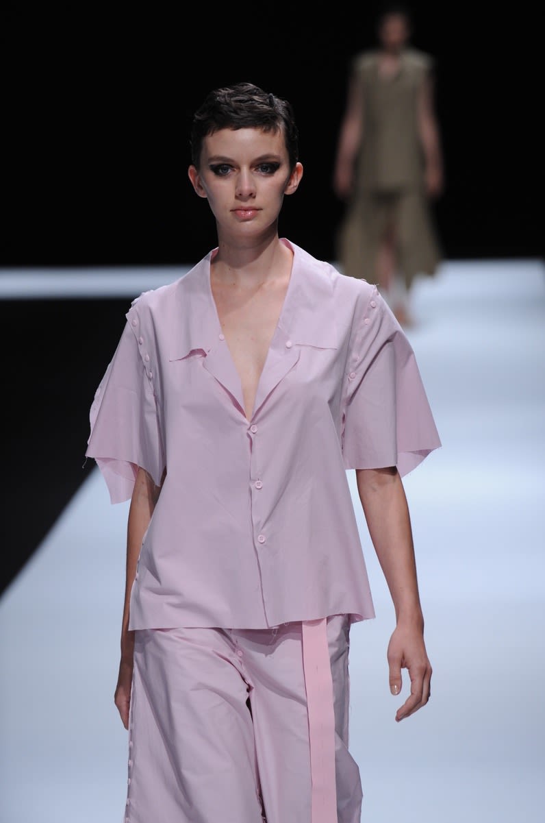 Female model wearing pastel purple suit designed by Enol Garcia Granda