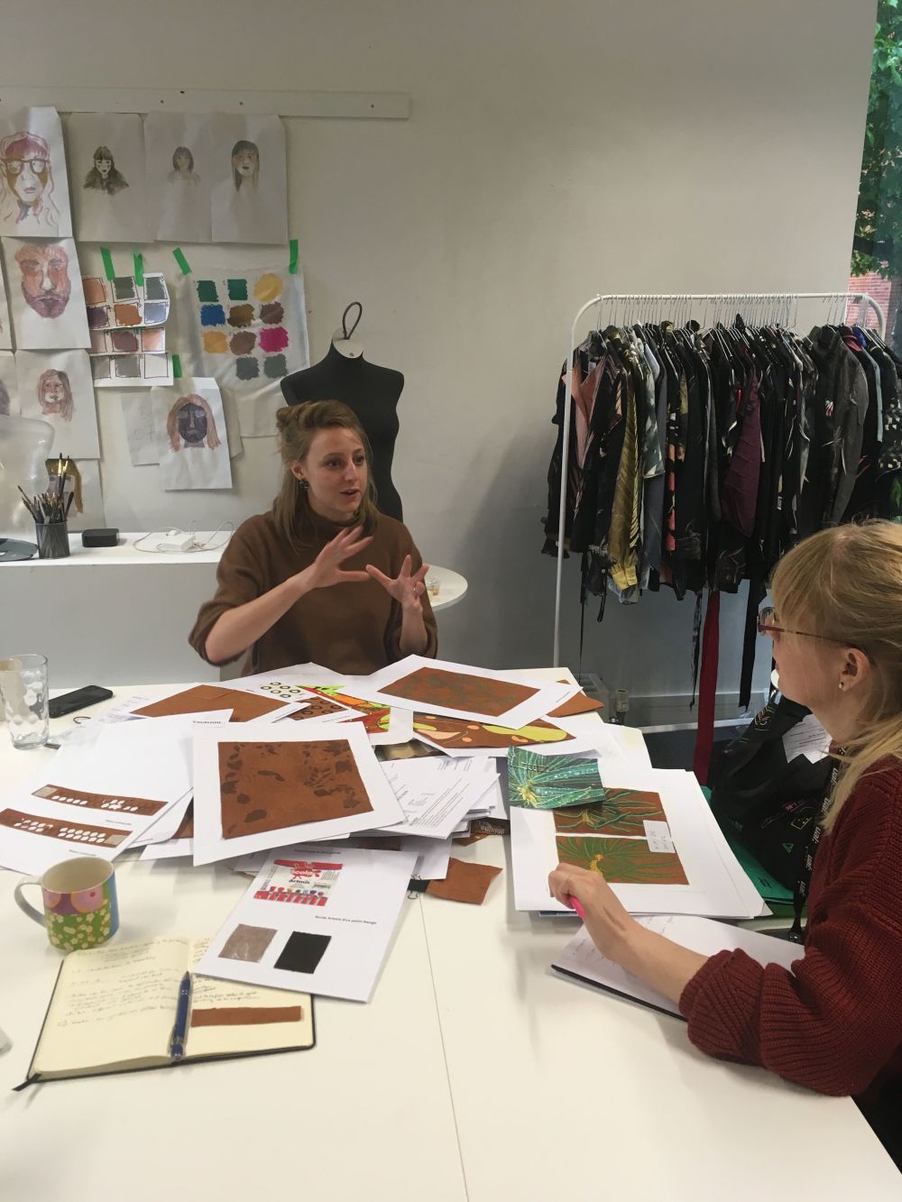 Cathryn Hall giving a tutorial to a student