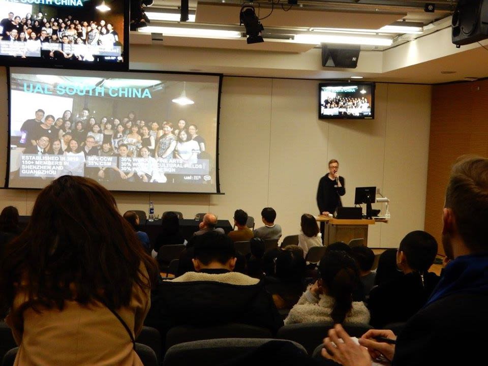 Photo from the back of the room of a presentation