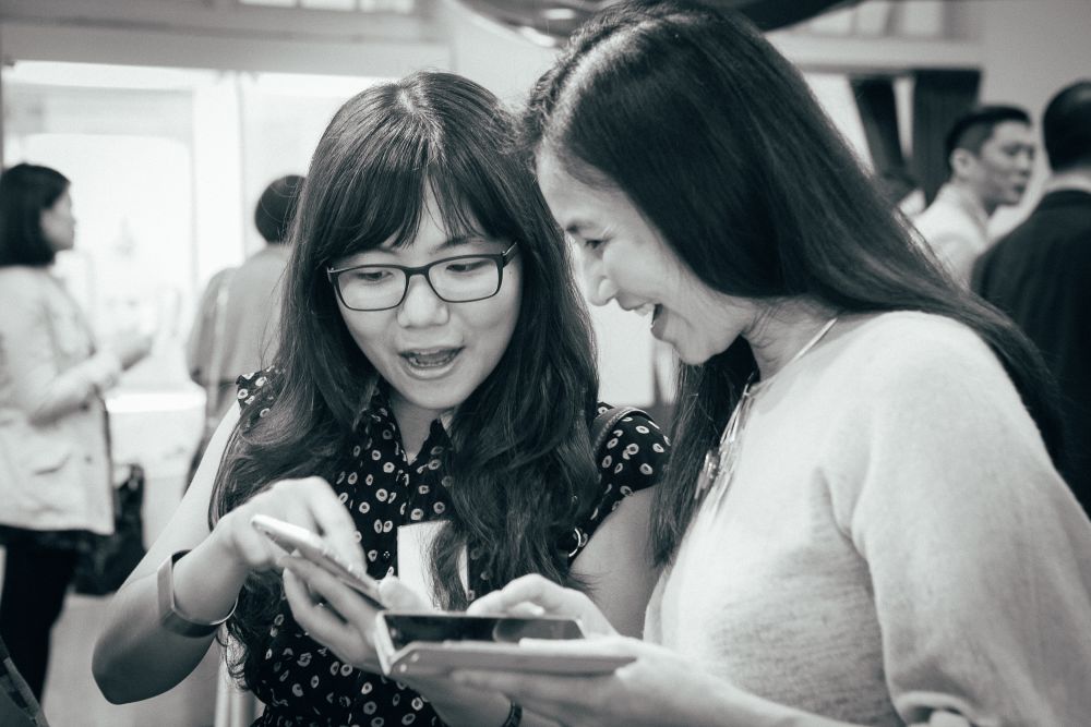 Black and white picture of 2 women talking