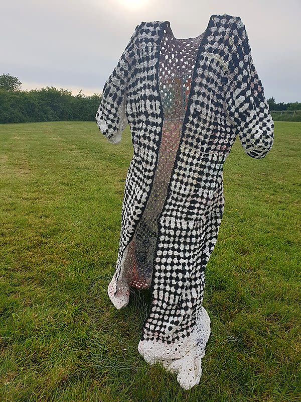 Black and white jacket photographed in a field