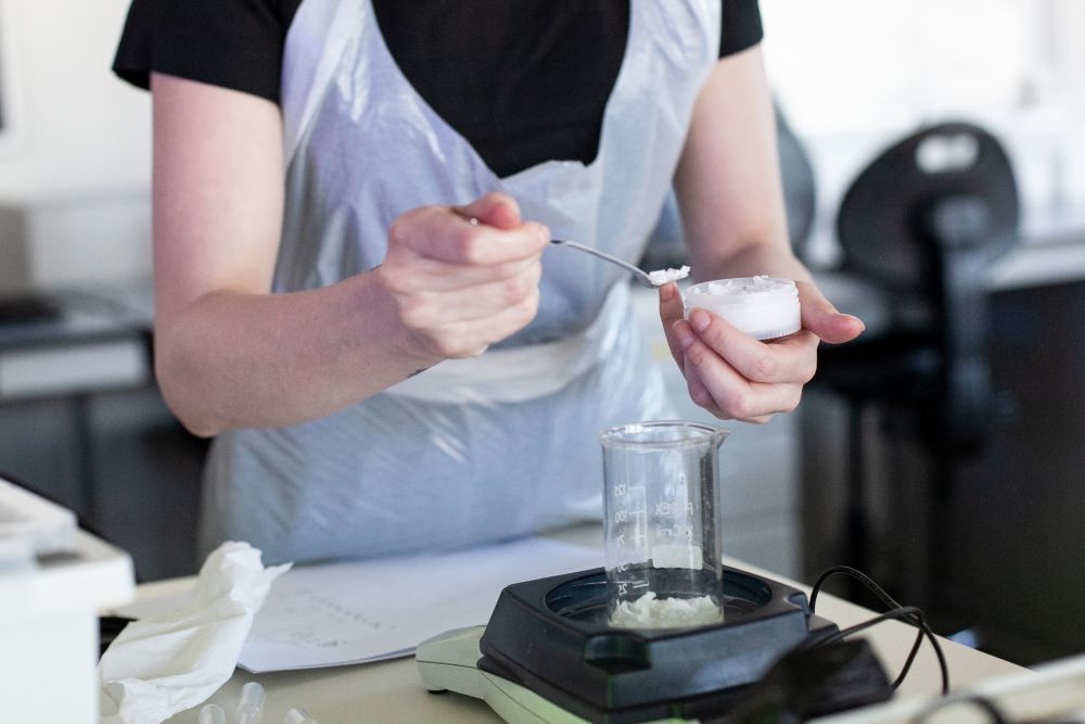 Students mixing products in lab