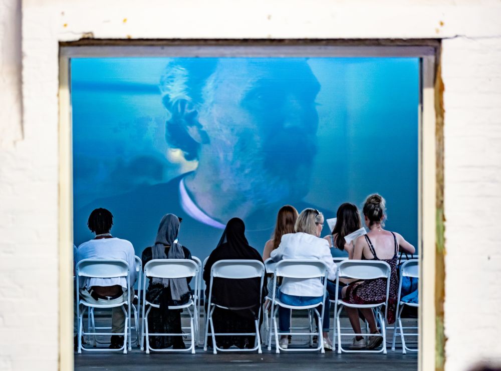 Attendees watch the student films in the screening room