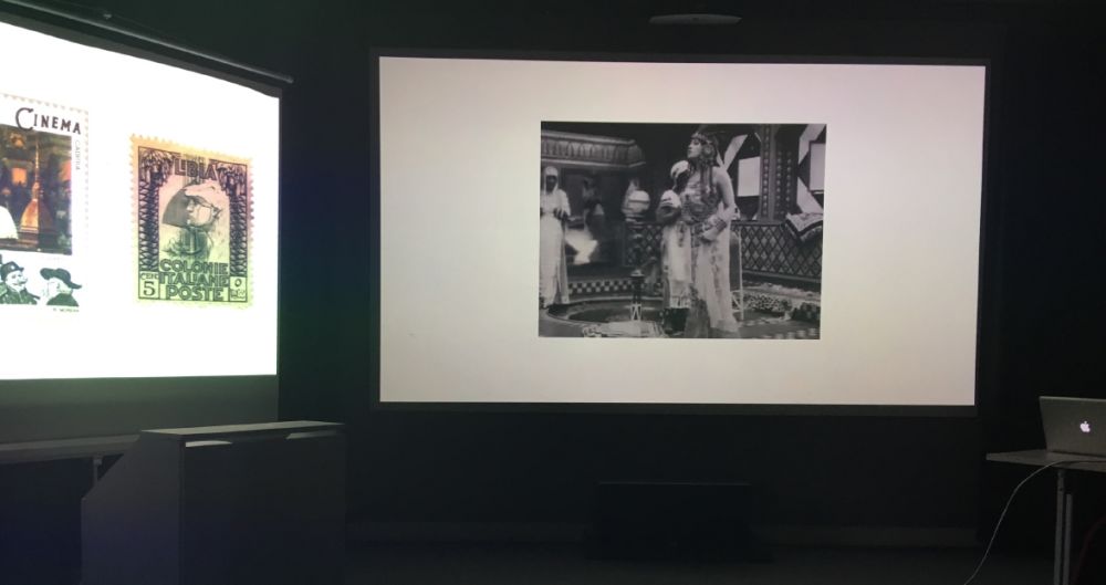 photographs projected on wall