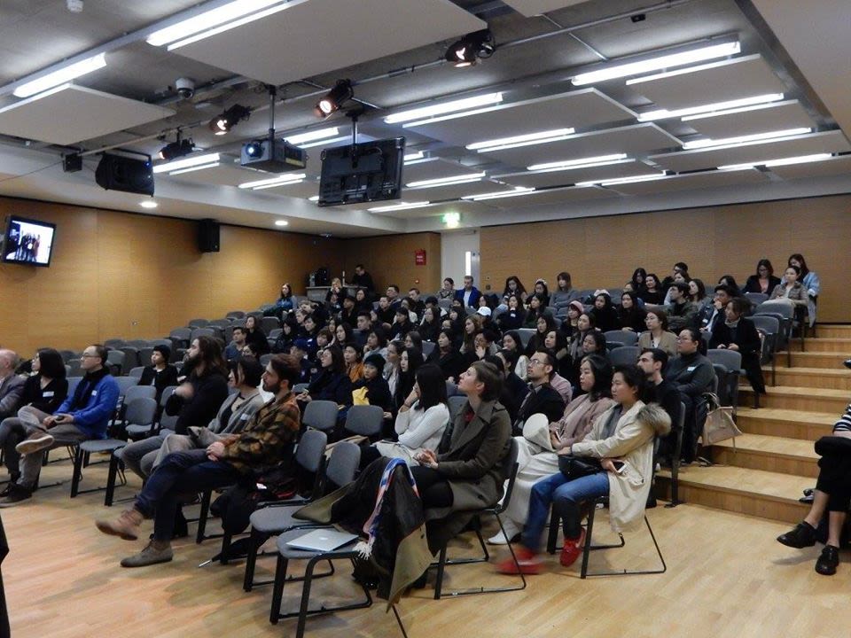 Audience listening to a presentation