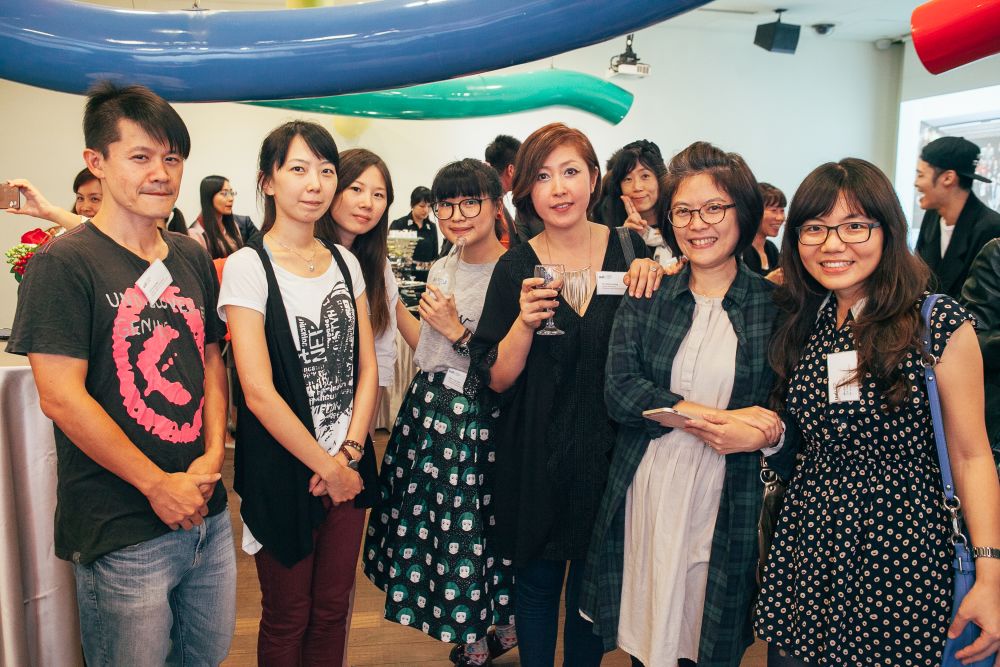 Small group of people looking to the camera