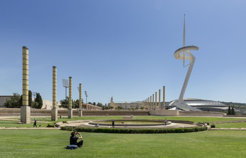 blue skies and buildings on a grass land