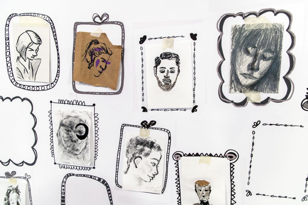 Entries to Short Course Portrait Competition on the wall