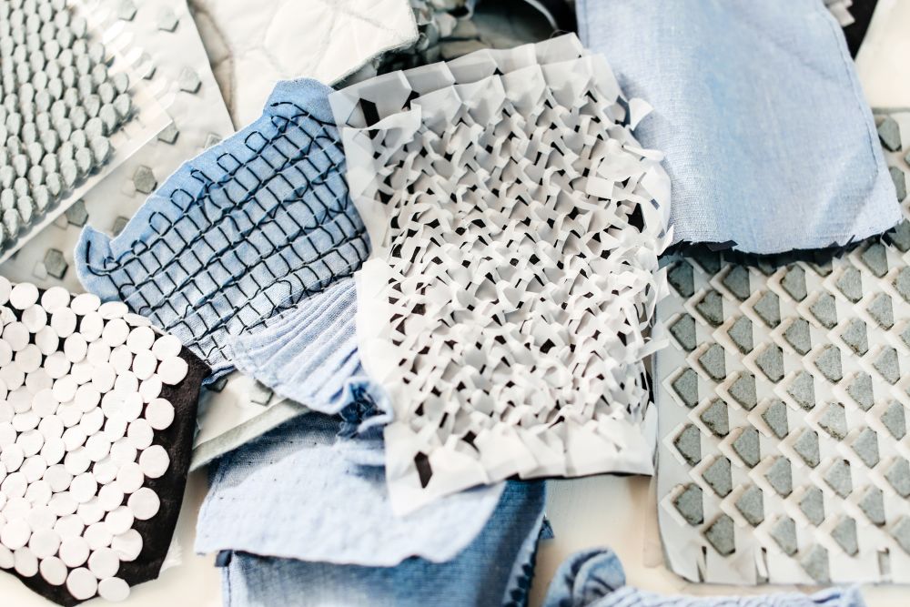 Laetitia's Forst's material samples spread across her workspace.