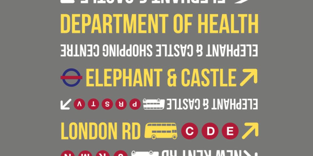 Castle and white text signage against a grey background