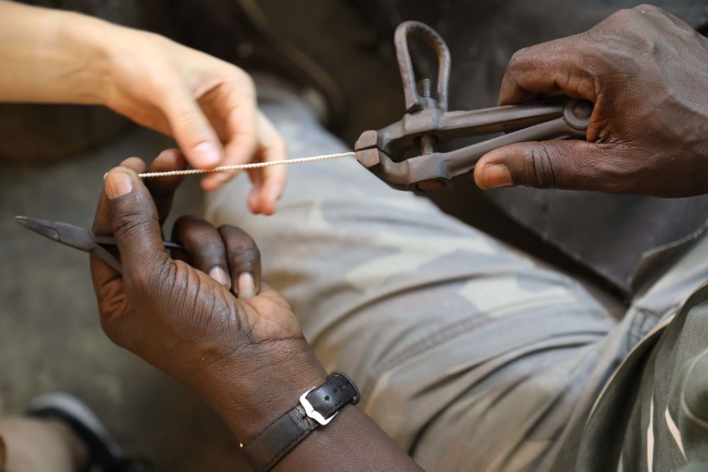 Wire being cut as part of Route-Artlantique project