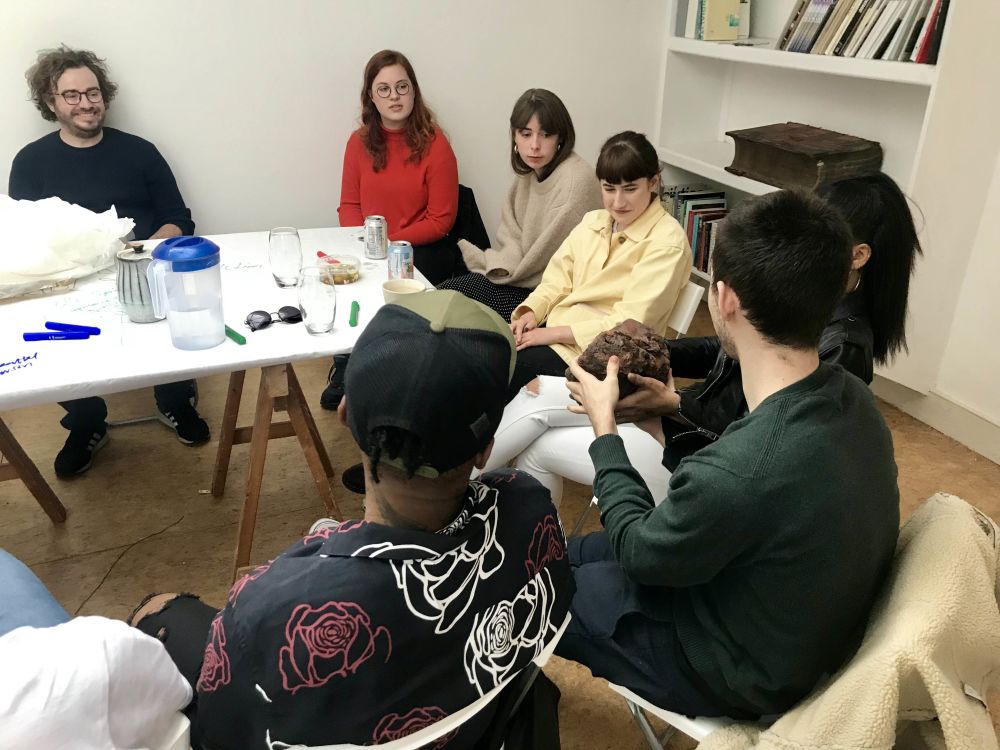 BA (Hons) Design for Art Direction students sitting together working on project