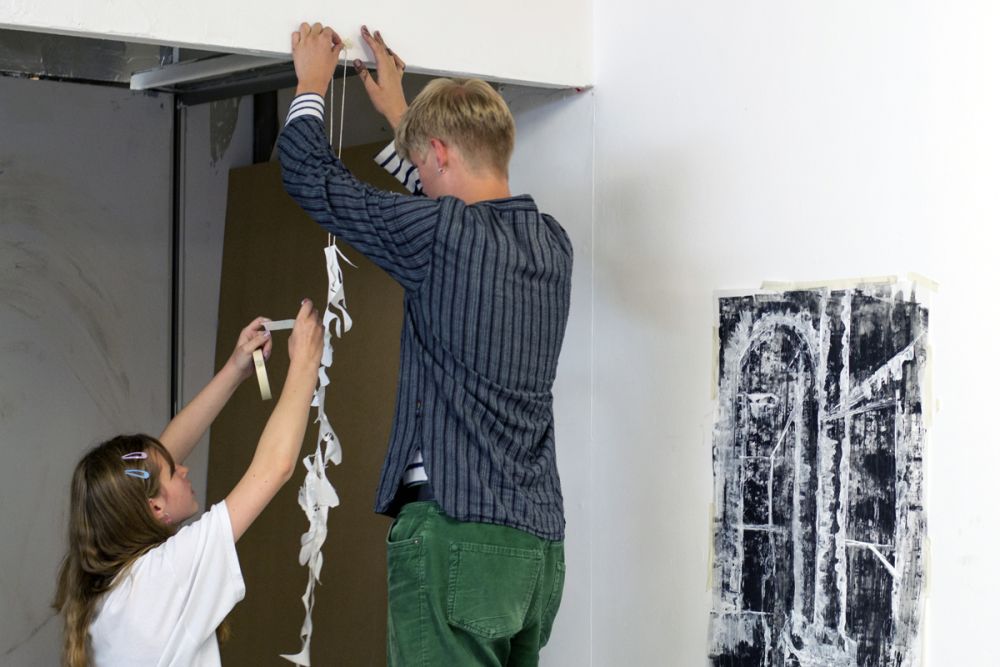 Students putting up exhibition.