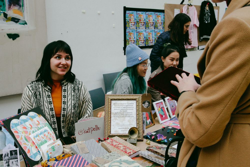 Holiday Market vendors and buyers in The Street CSM