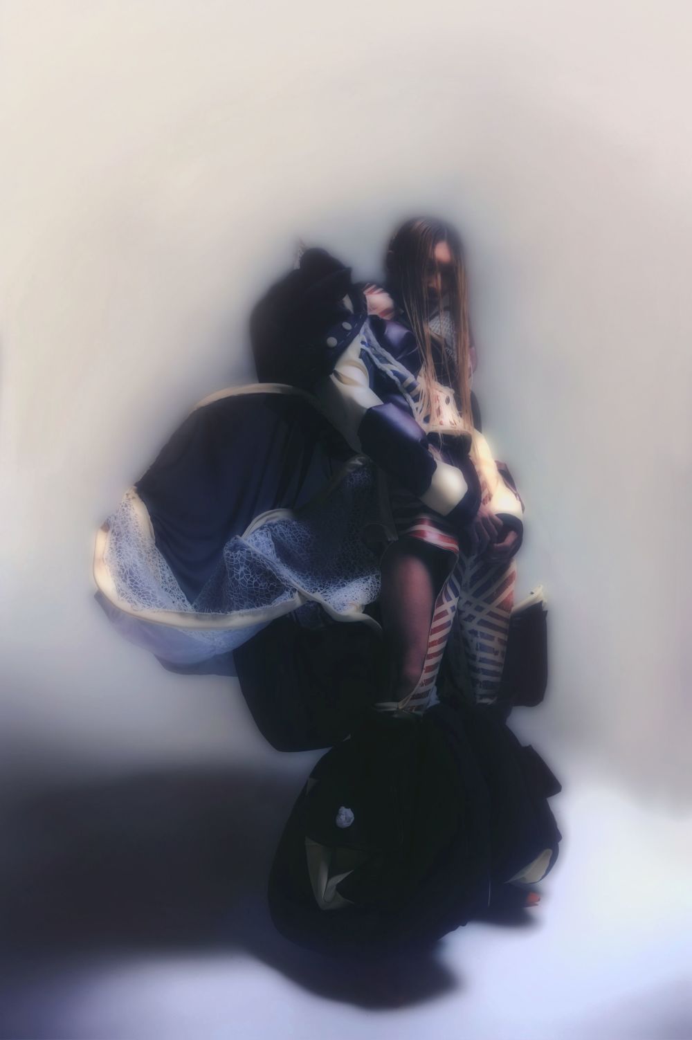 Figure wearing complex garments creating large silhouette