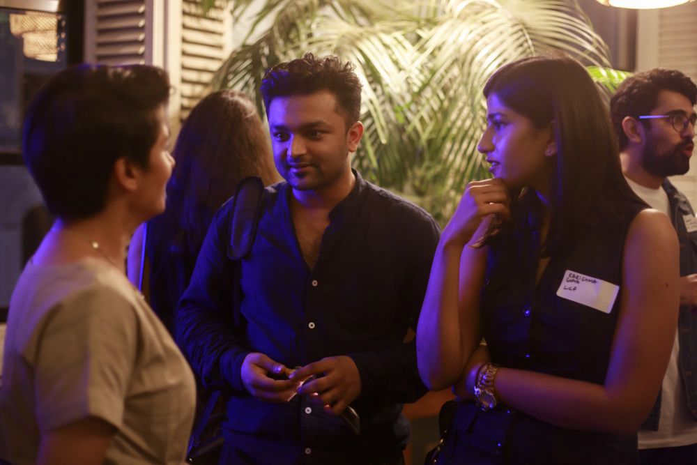 Three people chatting