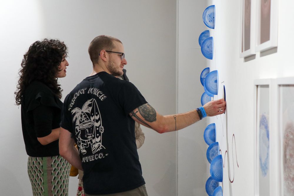Artist and researcher at exhibition