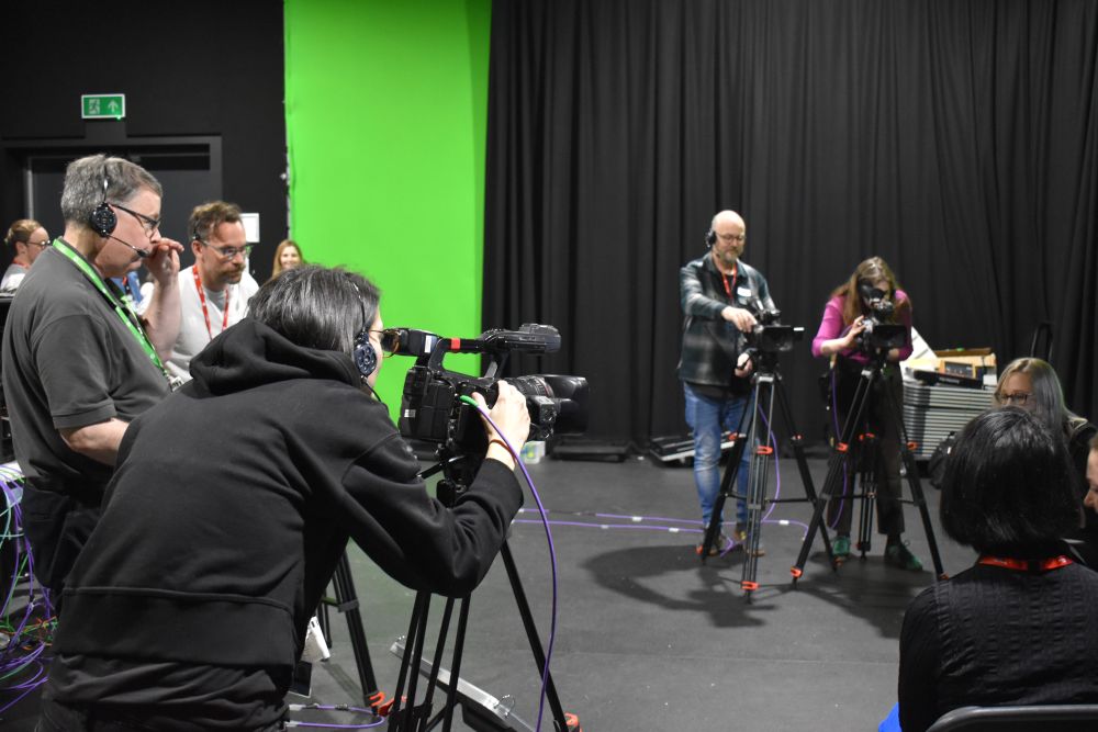 Staff using cameras