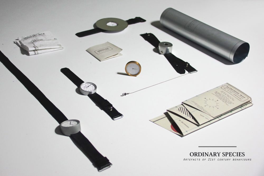 A series of watches and components laid out on a white surface