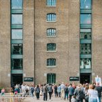 Photograph of people queuing outside the CSM building to get into the degree show