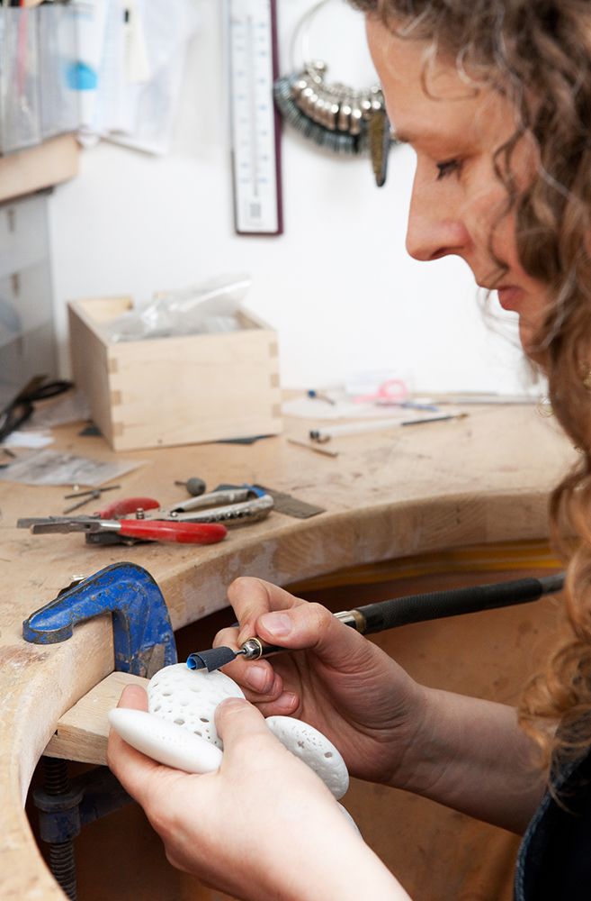 Sarah King in the jewellery studio, working. 