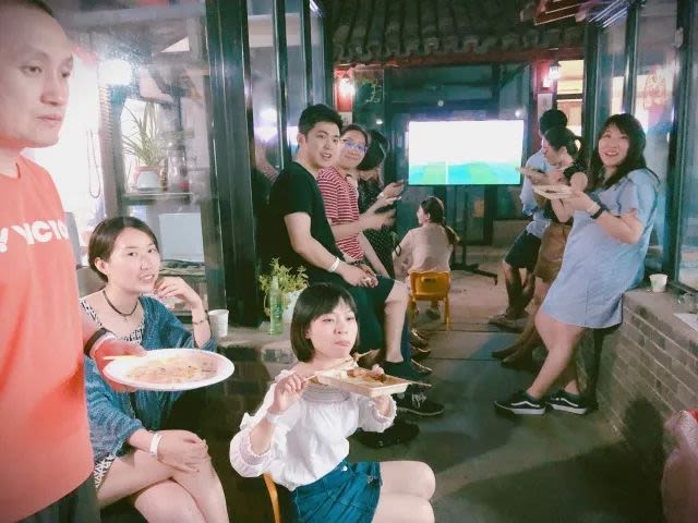 Group of people eating food and smiling