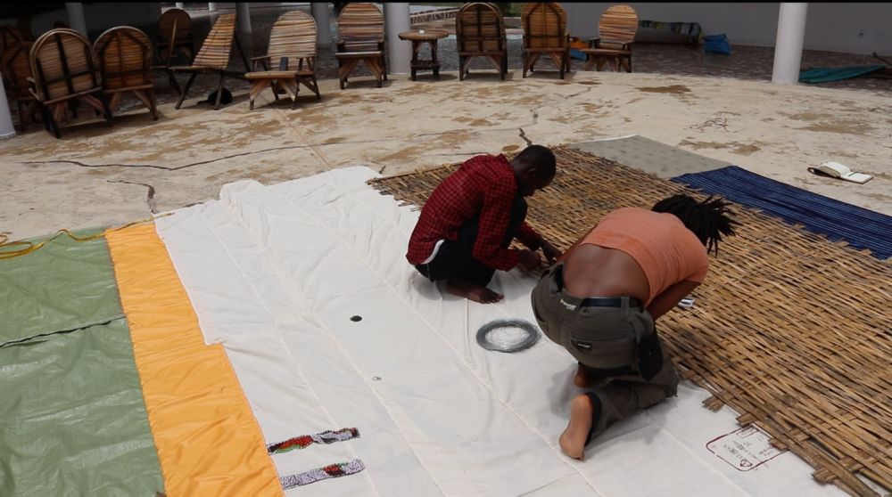 stitching fabric togethe ron the floor