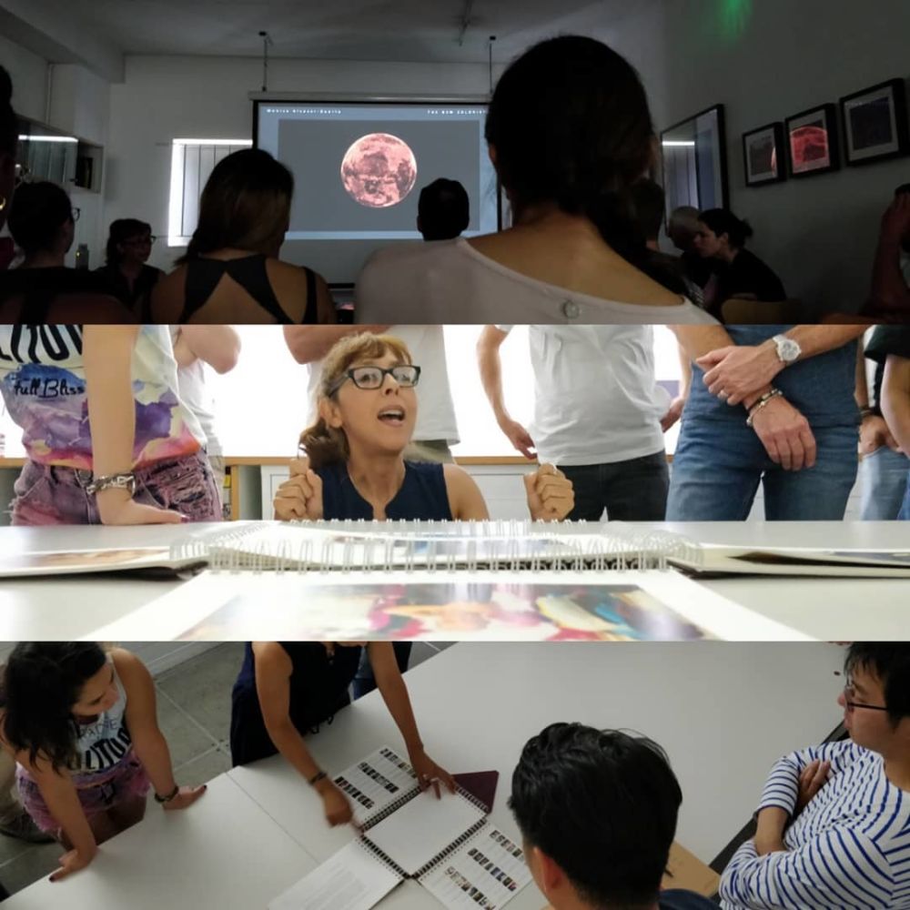 Woman talking in a room of people 