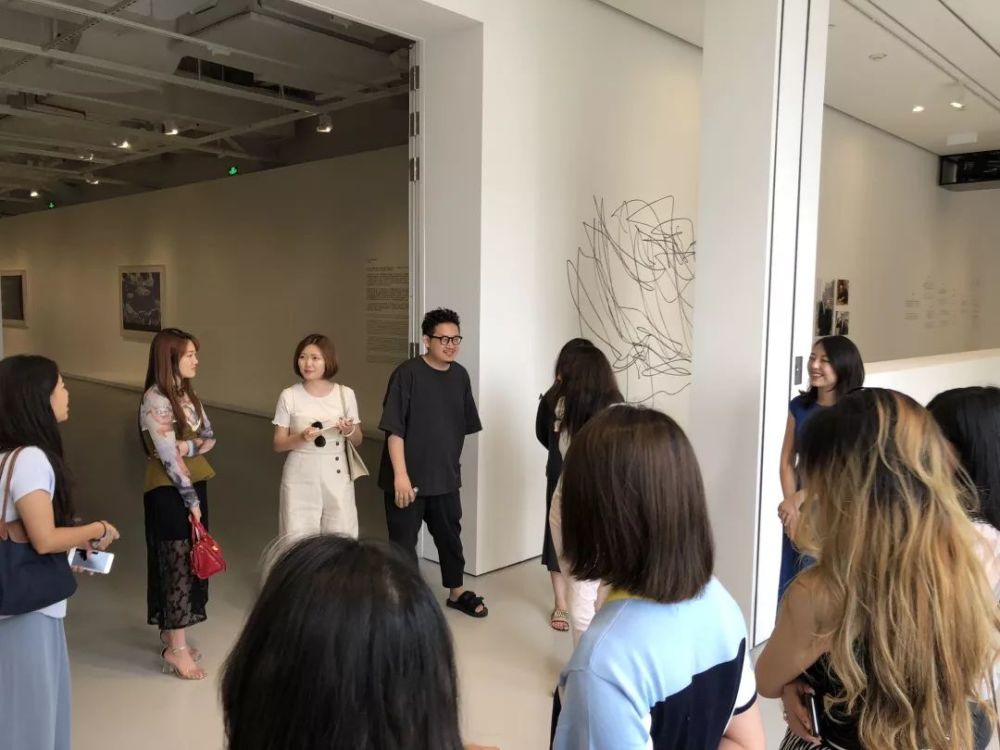 Group of people looking around an exhibition