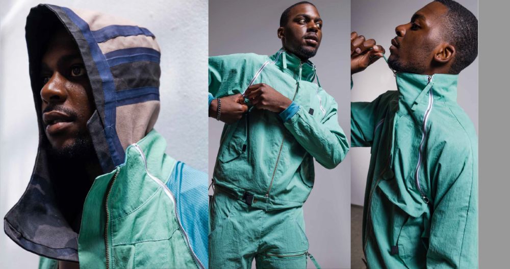 Male model in green tracksuit.