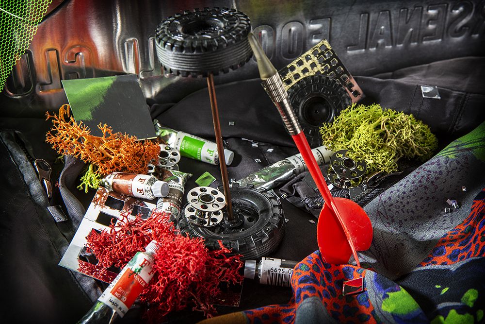 Work by Visual Merchandising - Interiors students, taken by Sarah Manning. A collage of objects featuring small paint tubes, toy car wheels and coloured coral.