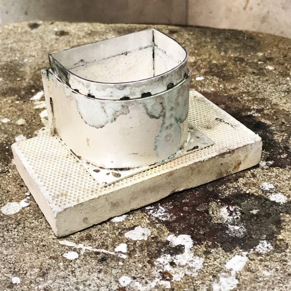 Silver box having just been fired.