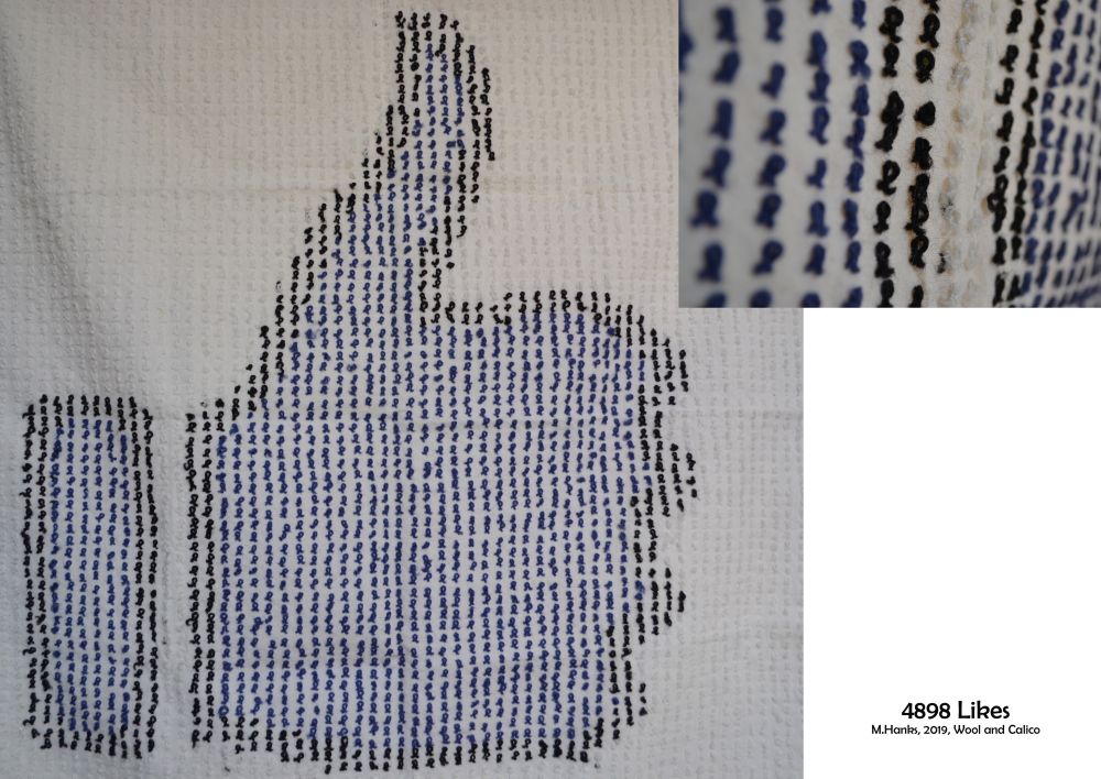 a picture of  the facebook like symbol made with thread