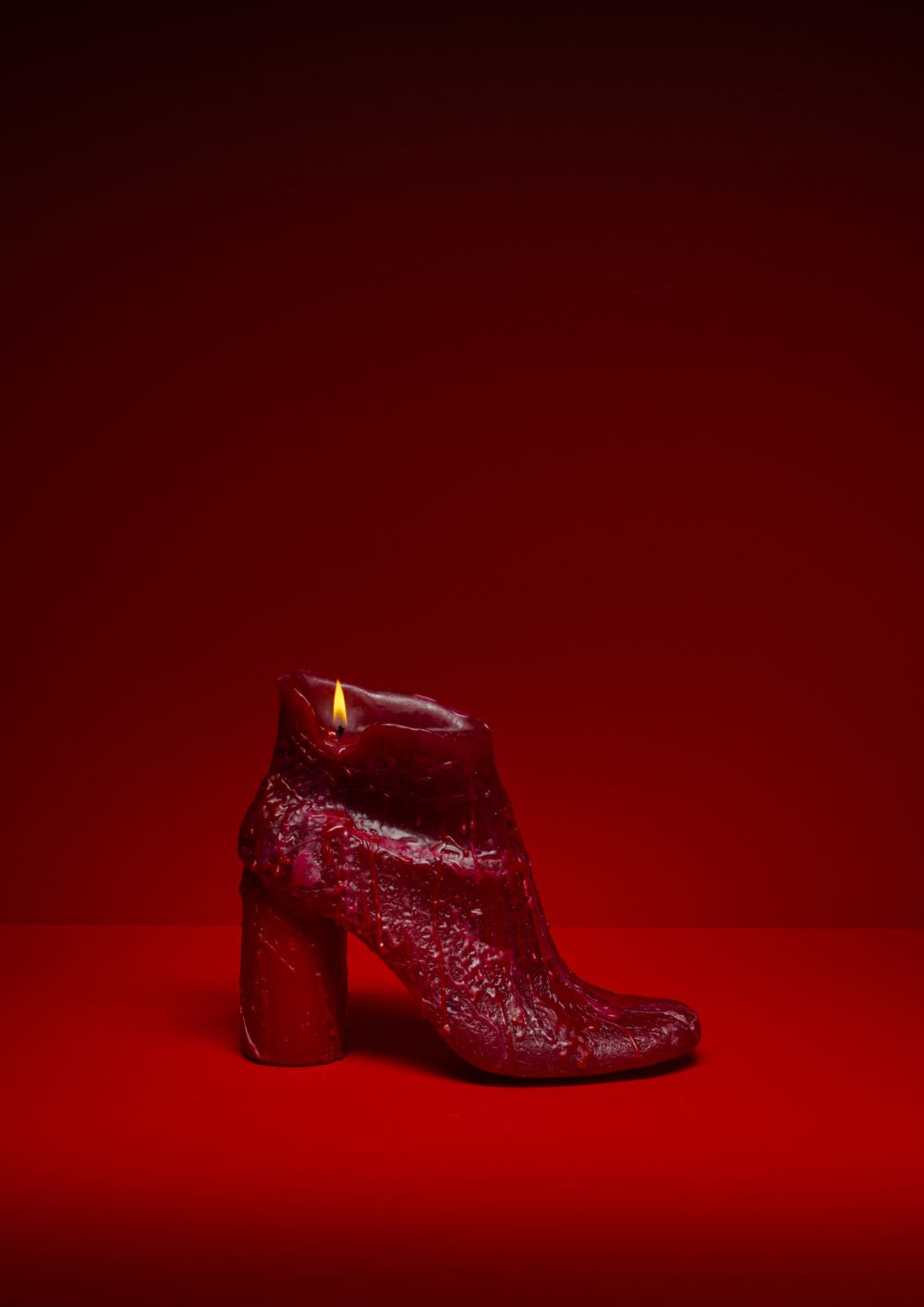 Red shoe against a red background