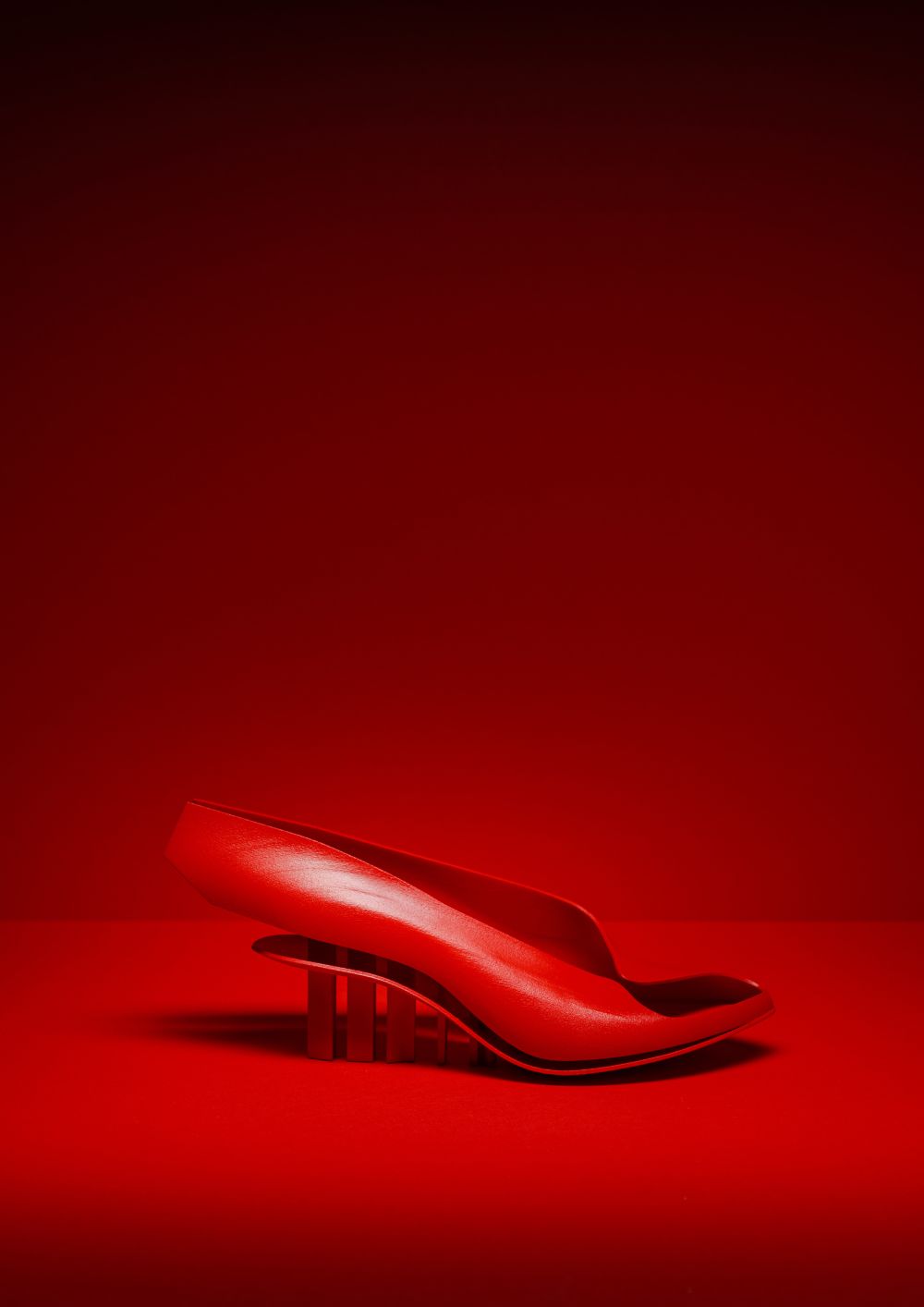 Red shoe against a red background