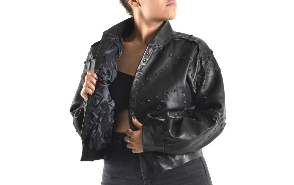 a picture of a model wearing a leather jacket