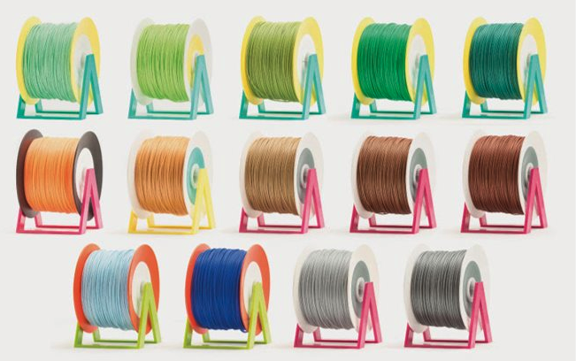 multiple rolls of filament (PLA) in various colours across 3 rows