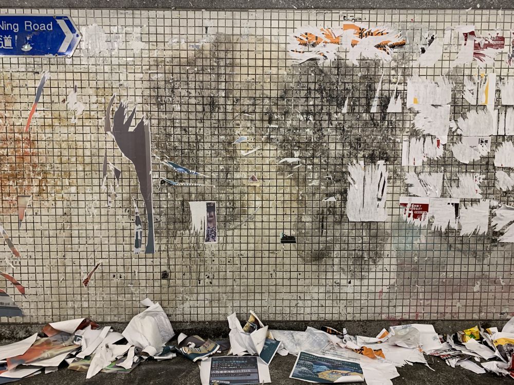 underground station walls posters ripped off