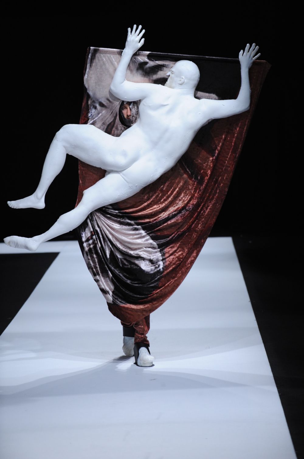 Male model wearing a human shaped costume designed by Christian Bronstein