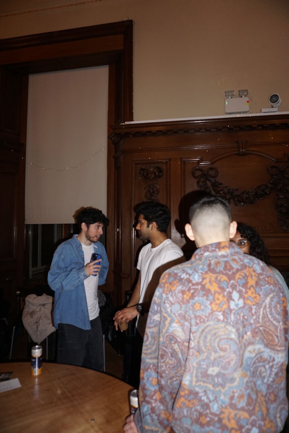 a group of people standing and talking