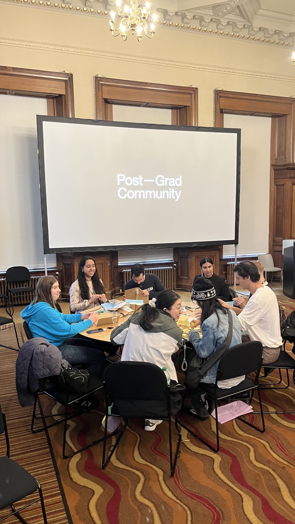 People sitting around a table and talking