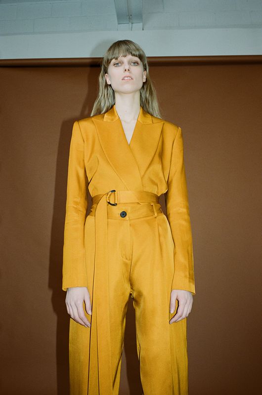 Model wearing an outfit from brand HEW