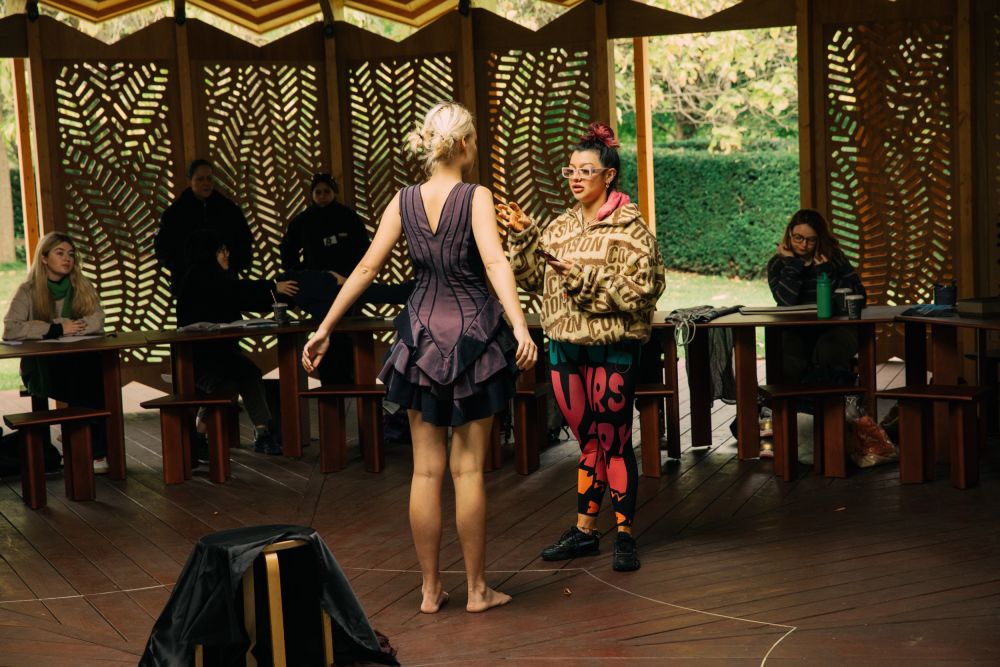 Model and facilitator talking about poses