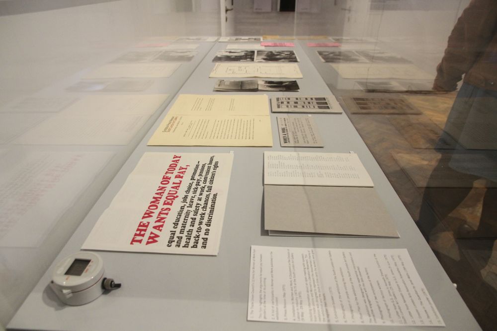 A glass case filled with archival documents